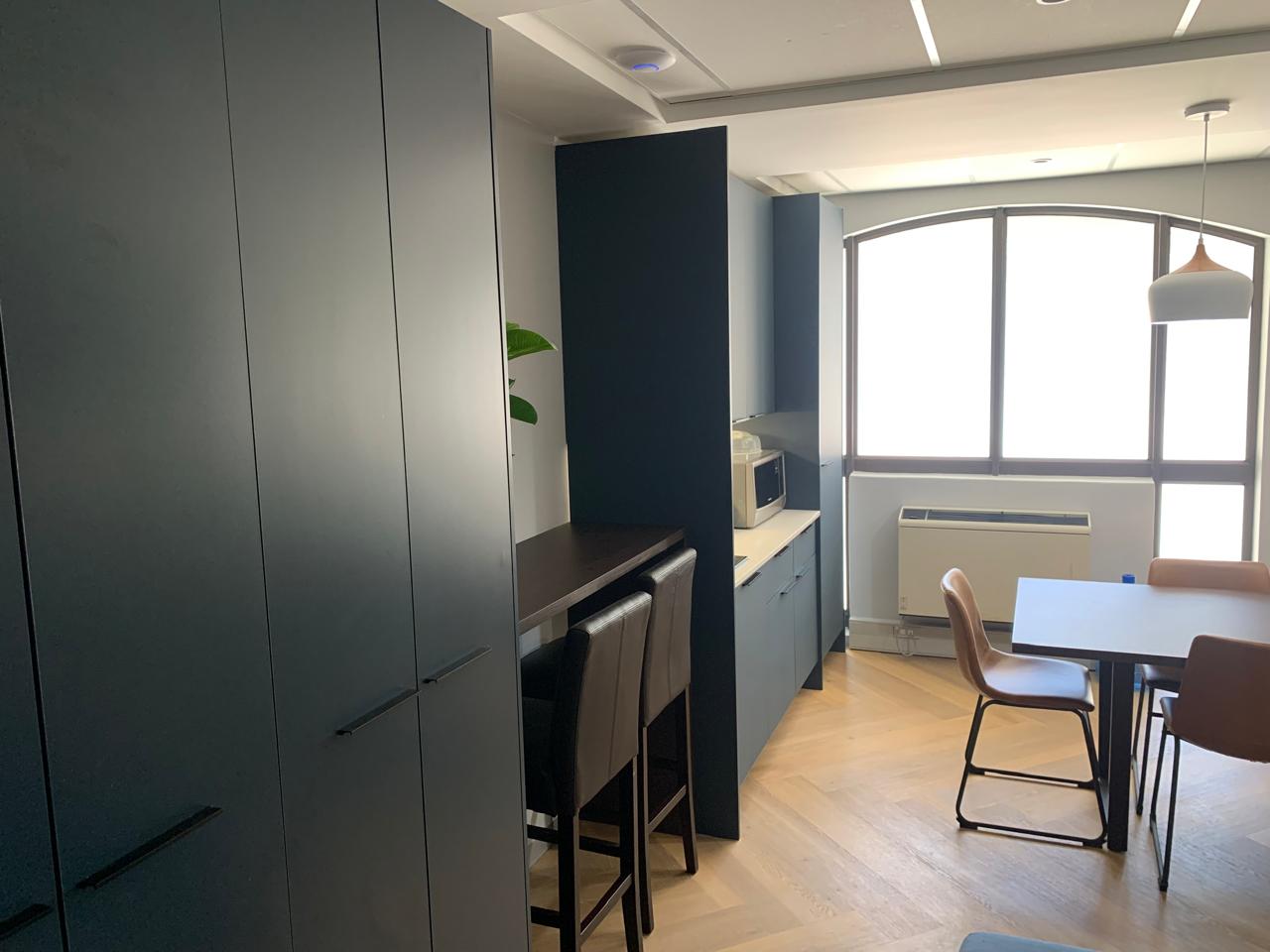 Navy Office Kitchenette & Standing Bar — custom cabinetry by Modern Kitchens & Cupboards