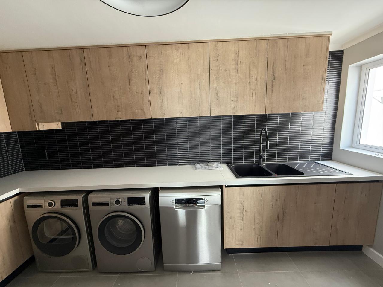 Oak Scullery & Laundry Run — custom cabinetry by Modern Kitchens & Cupboards