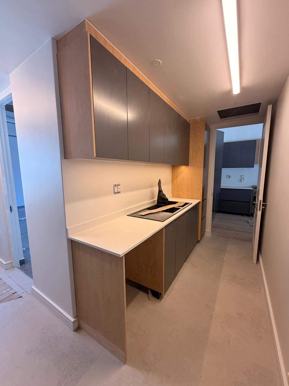 Raked-Ceiling Scullery — custom cabinetry by Modern Kitchens & Cupboards
