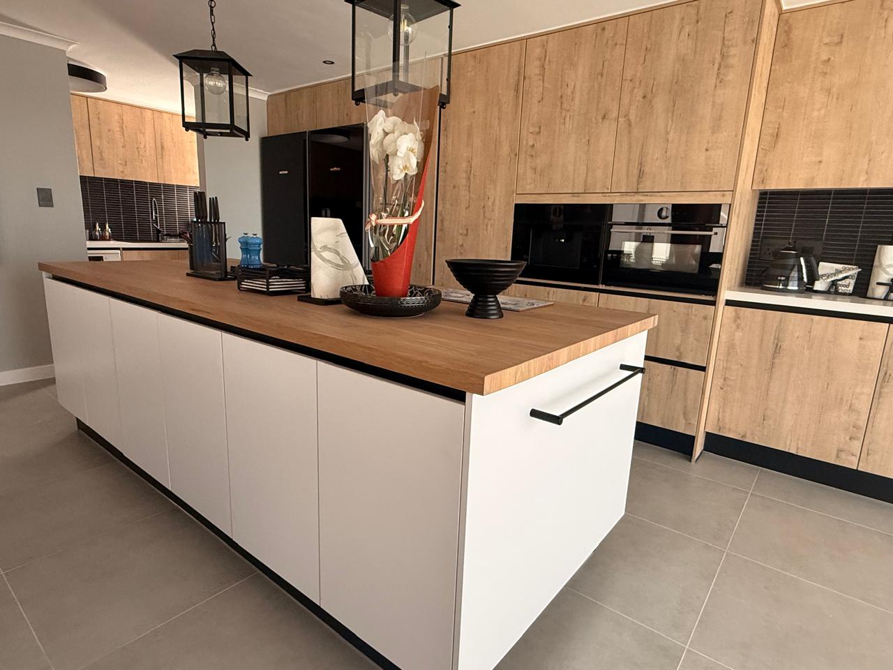 Open-Plan Oak & White Kitchen — custom cabinetry by Modern Kitchens & Cupboards